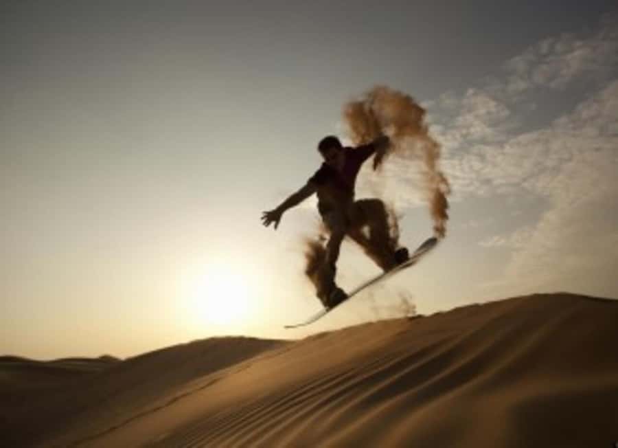 Desert Safari, Quad Bike, Camel Ride, Falcon & Sandboarding - Deflating tires before the dune run