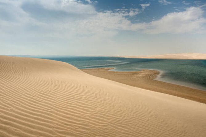 Doha Desert Quad Bike adventure with group, and Sand dune Driving - Sunset, photographs, and the Inland Sea setting
