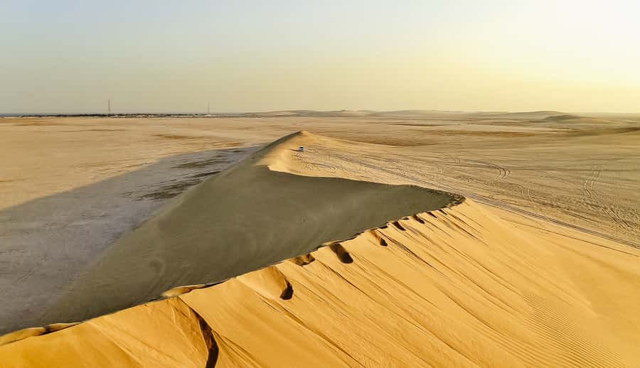 Doha: Desert Safari Dune Bashing, Sandboarding, & Camel Ride - From Doha streets to the southern desert