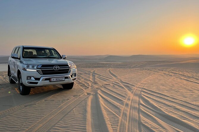 Doha: Desert Safari, Sand Boarding, Camel Ride & Inland Sea Tour - Sandboarding for a simple burst of fun