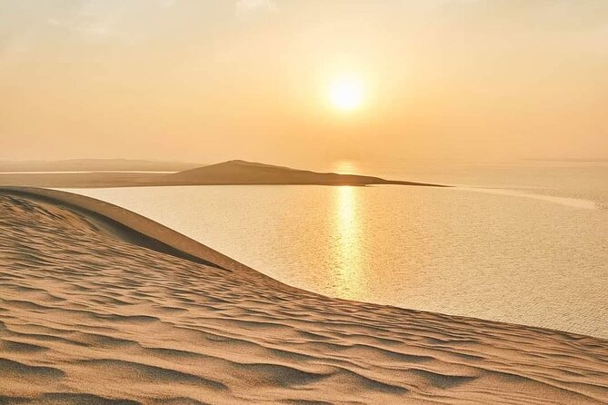 "Doha Desert : Safari, Sandboarding, Camel Ride & Inland Sea" - Sandboarding on soft dunes