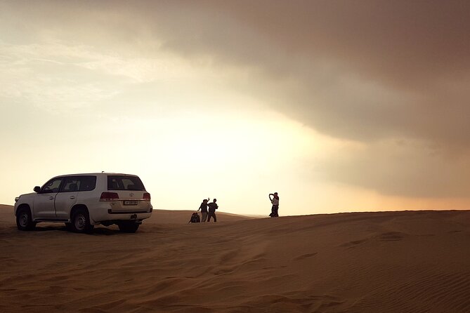 Doha: Desert Safari With Quad bike ,Camel Ride And Sand Boarding - Pickup, timing, and group size