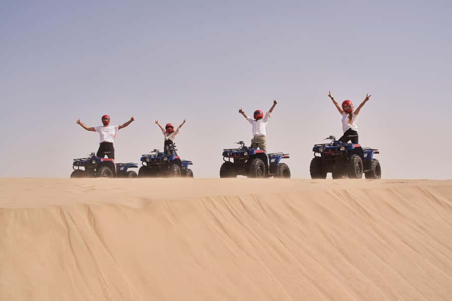 Doha: Desert Safari with Quad Bike, Sandboard & Camel Ride - Sandboarding on the soft slopes
