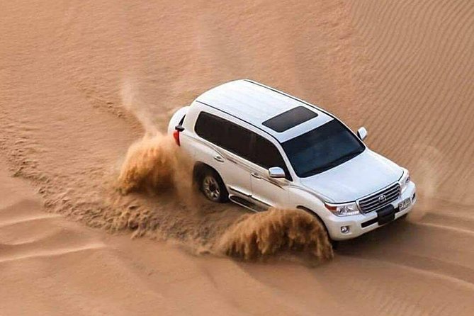 Doha :Half Day Desert Safari | Camel Riding | ATV | Sand Surfing - Dune bashing across Qatar’s open sand