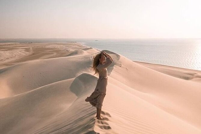 Doha Half Day Desert Safari Dune Bashing CamelRide & Sandboarding - Dune bashing across Qatar’s rolling sand