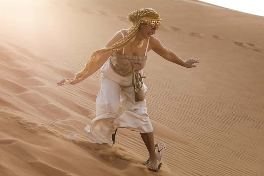 Doha: Half-Day Desert Safari, Quad Bike, Camels & Inland Sea - Sandboarding down the soft dunes