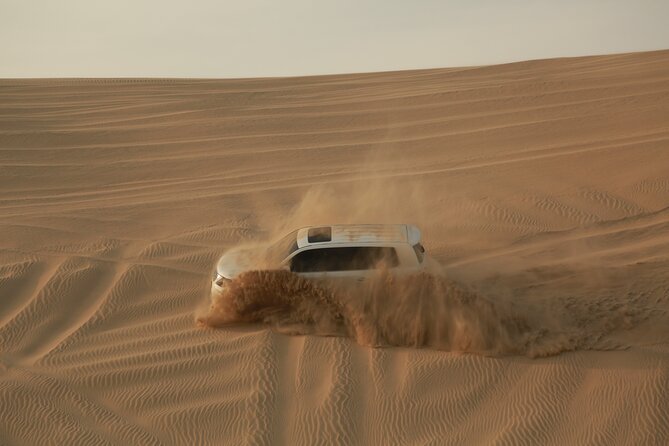 Doha: Half Day Desert Safari with Camel Ride and Inland Sea Tour - Sandboarding adds a simple challenge