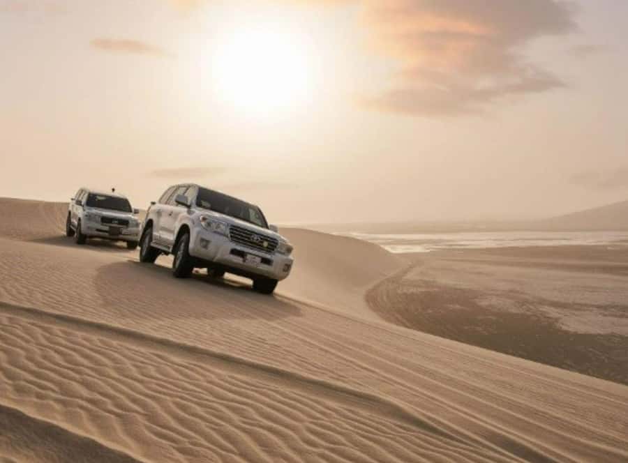 Doha : Inland Sea Desert Safari ,Camel Ride & Sandboarding - The Land Cruiser takes over