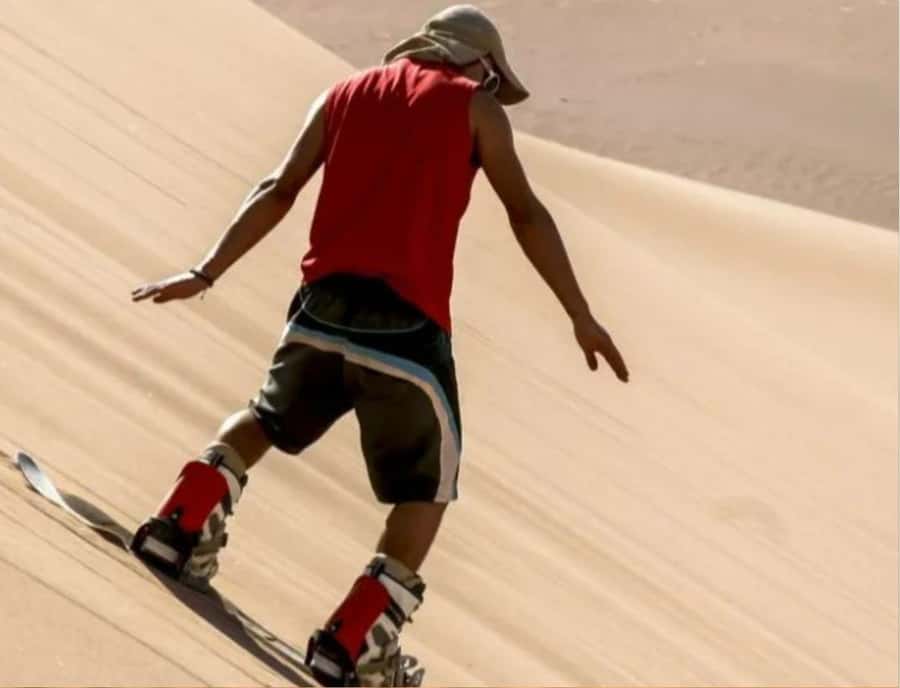 Doha : Inland Sea Desert Safari ,Camel Ride & Sandboarding - Sandboarding on the soft slopes
