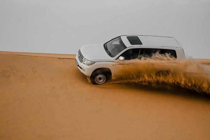 Doha Qatar ATV Quad Bike Buggy Desert Adventure and Camel Ride - Sunset timing can improve the desert views