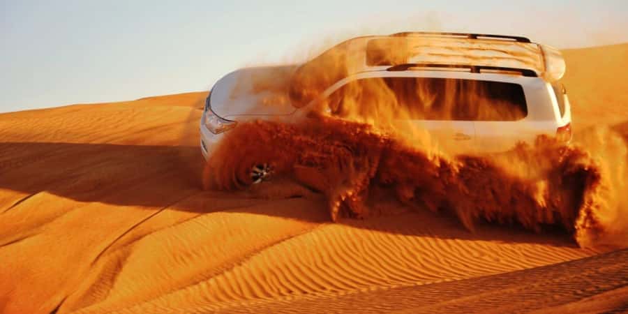 Doha: Safari, Camel Ride, Sandboarding and Inland Sea Tour - Leaving Doha for open sand