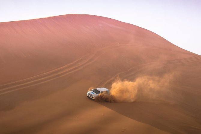 Doha: Sunset Desert Safari, Camels, Sandboarding & Inland Sea - Dune bashing across Qatar’s sand
