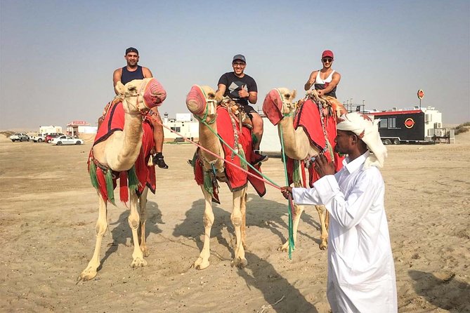 Doha: Sunset Desert Safari, Camels, Sandboarding & Inland Sea - The camel stop: traditional, brief, and worth understanding