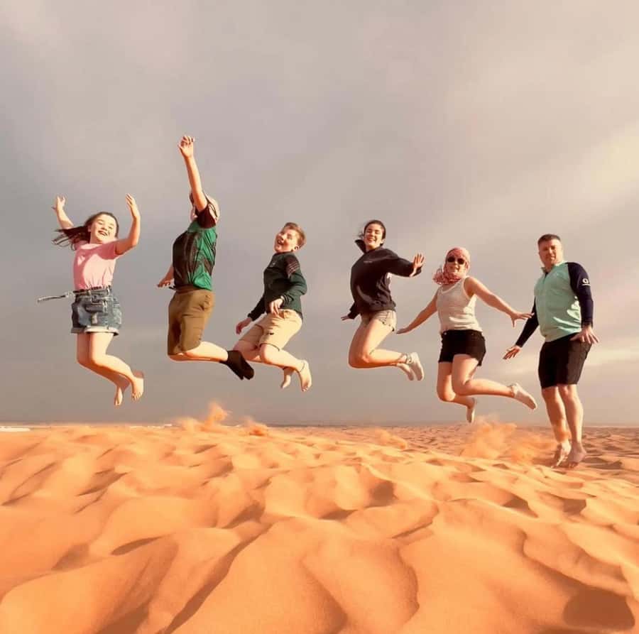 Doha: Sunset Desert Safari with Camel Ride & Sandboarding - Dune bashing with an experienced driver