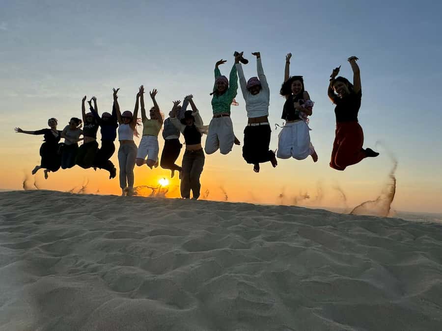 Doha: Sunset Safari, Dune Bashing, Sandboarding & Camel Ride - A short camel ride at the local camp