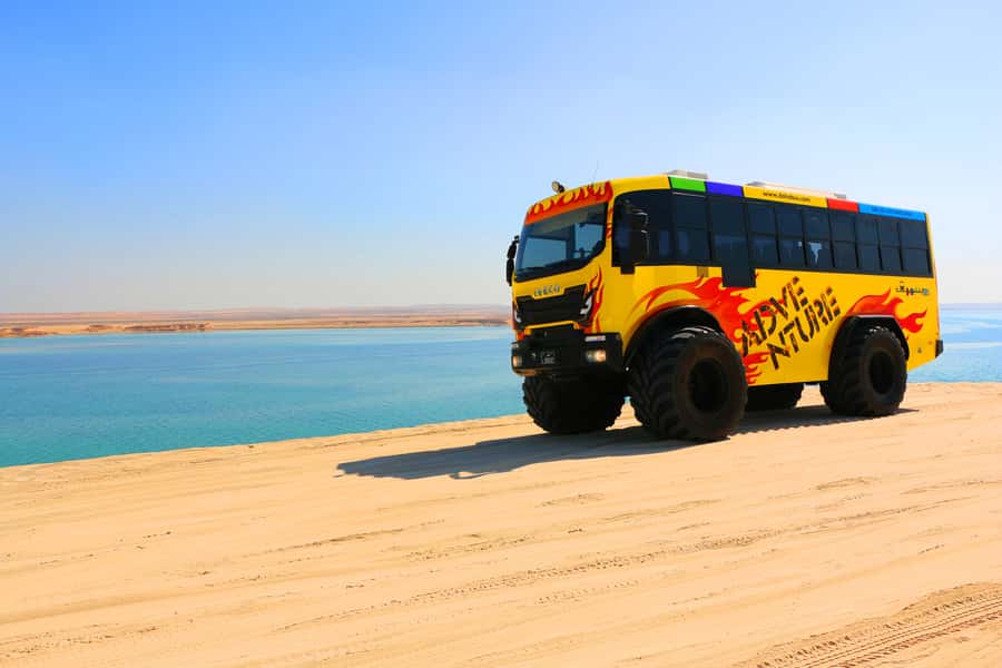 From Doha: Exclusive Monster Bus Safari Experience - 45 minutes of dune bashing over Sealine