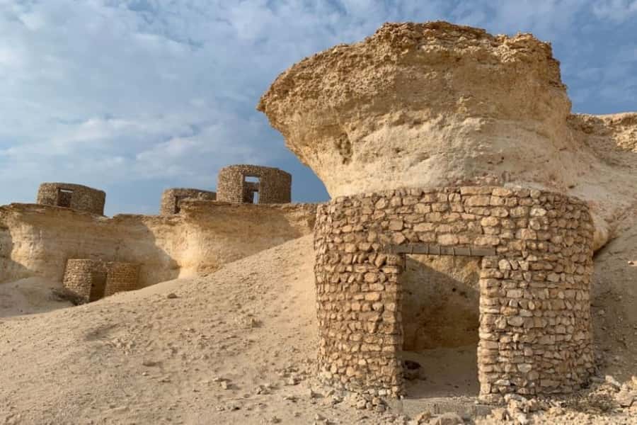 From Doha: Private West Coast and Camel Race Track Tour - Zekreet and Mushroom Rock bring the strange scenery
