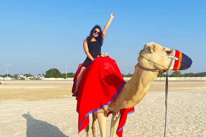 Half Day Night and Morning Desert Safari Camel and Sand Boarding - Sealine Beach: camels, coffee, and tire preparation