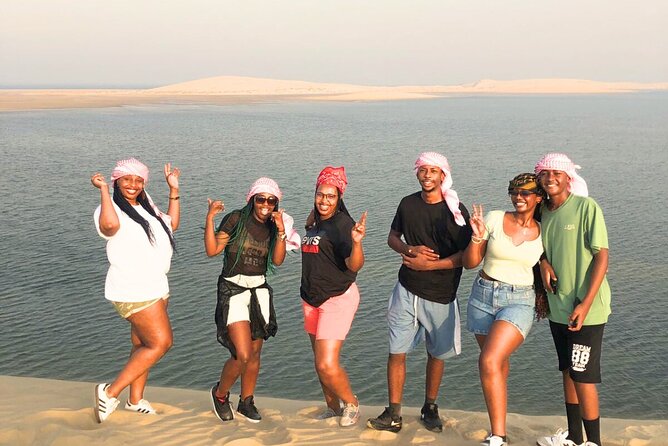 Half Day Safari Tour With Camel Ride and Sand Boarding in Doha - Sandboarding on the soft dunes
