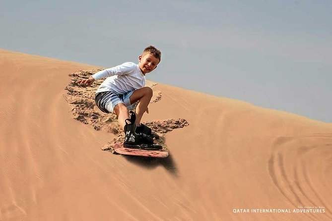 Private Full Day Desert Safari - Dune driving, sandboarding, and camel riding