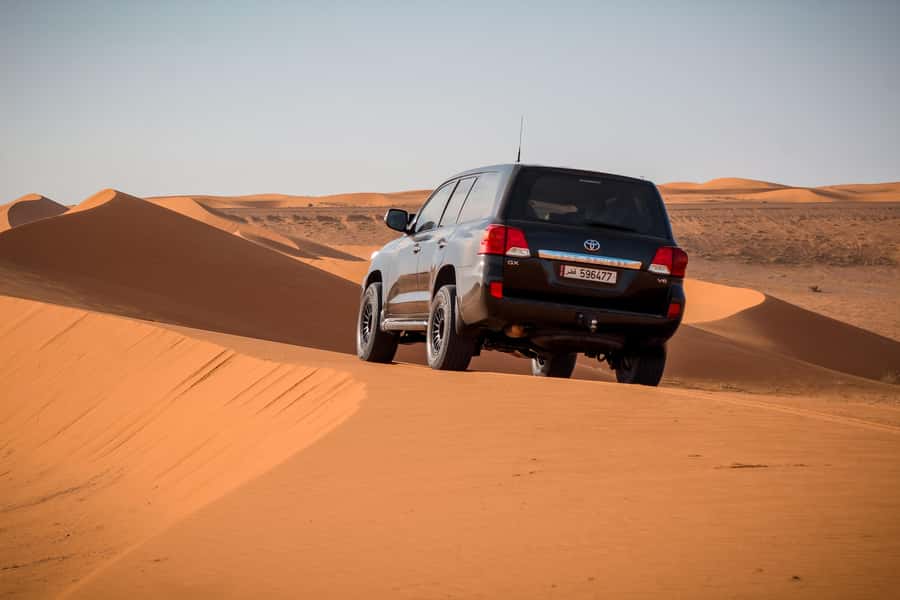 Qatar Desert Safari, Quad bike, Camel Ride and Sandboarding - Leaving Doha in an air-conditioned 4x4